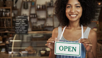 woman-holding-open-sign